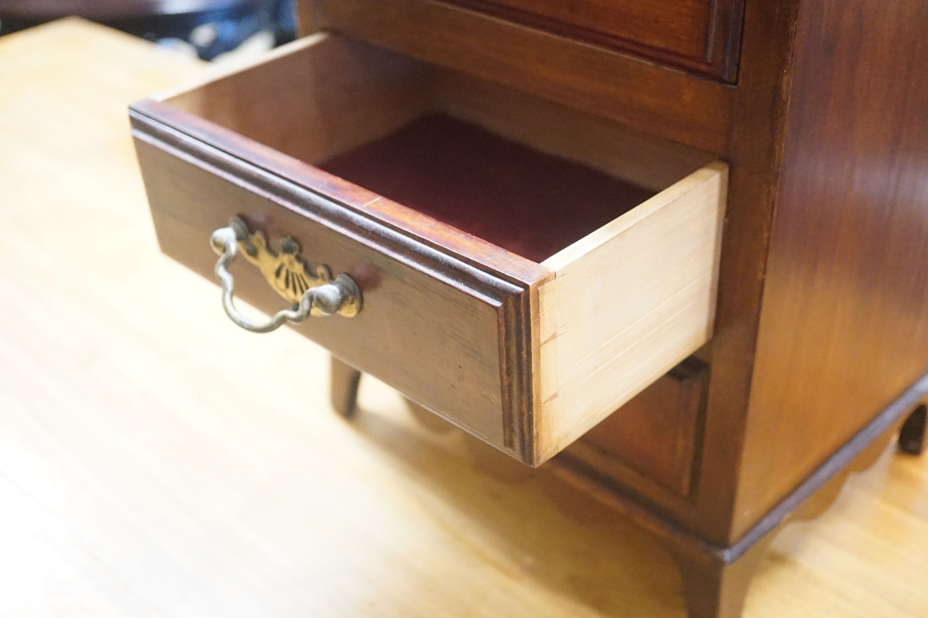 A late Victorian mahogany miniature four drawer chest, width 28cm depth 28cm height 42cm